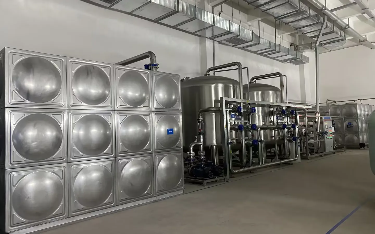 Stainless-steel tanks pretreatment skids and controls in an energy storage battery manufacturing water room