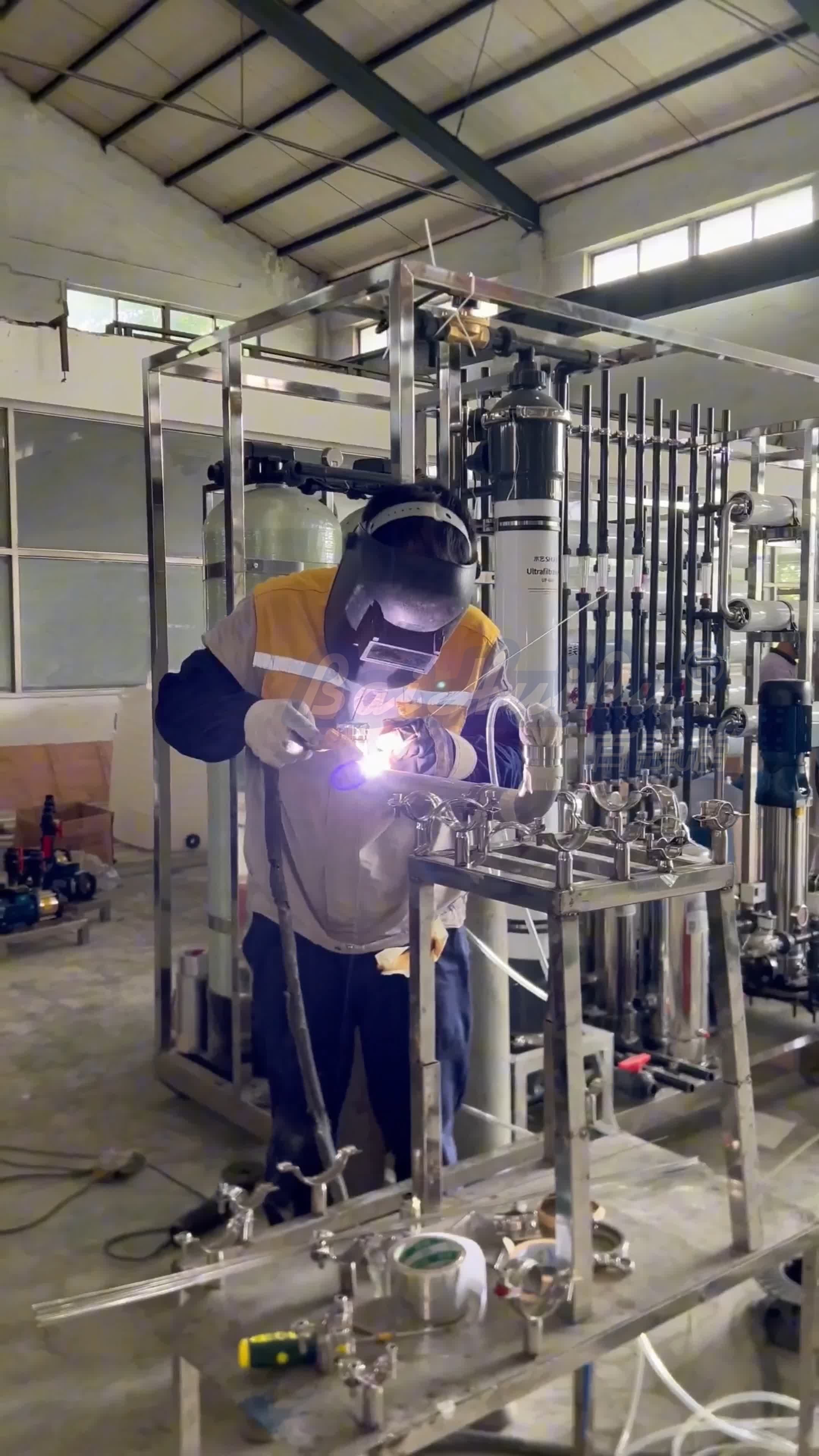 Technician welding water treatment equipment at Baihuipu