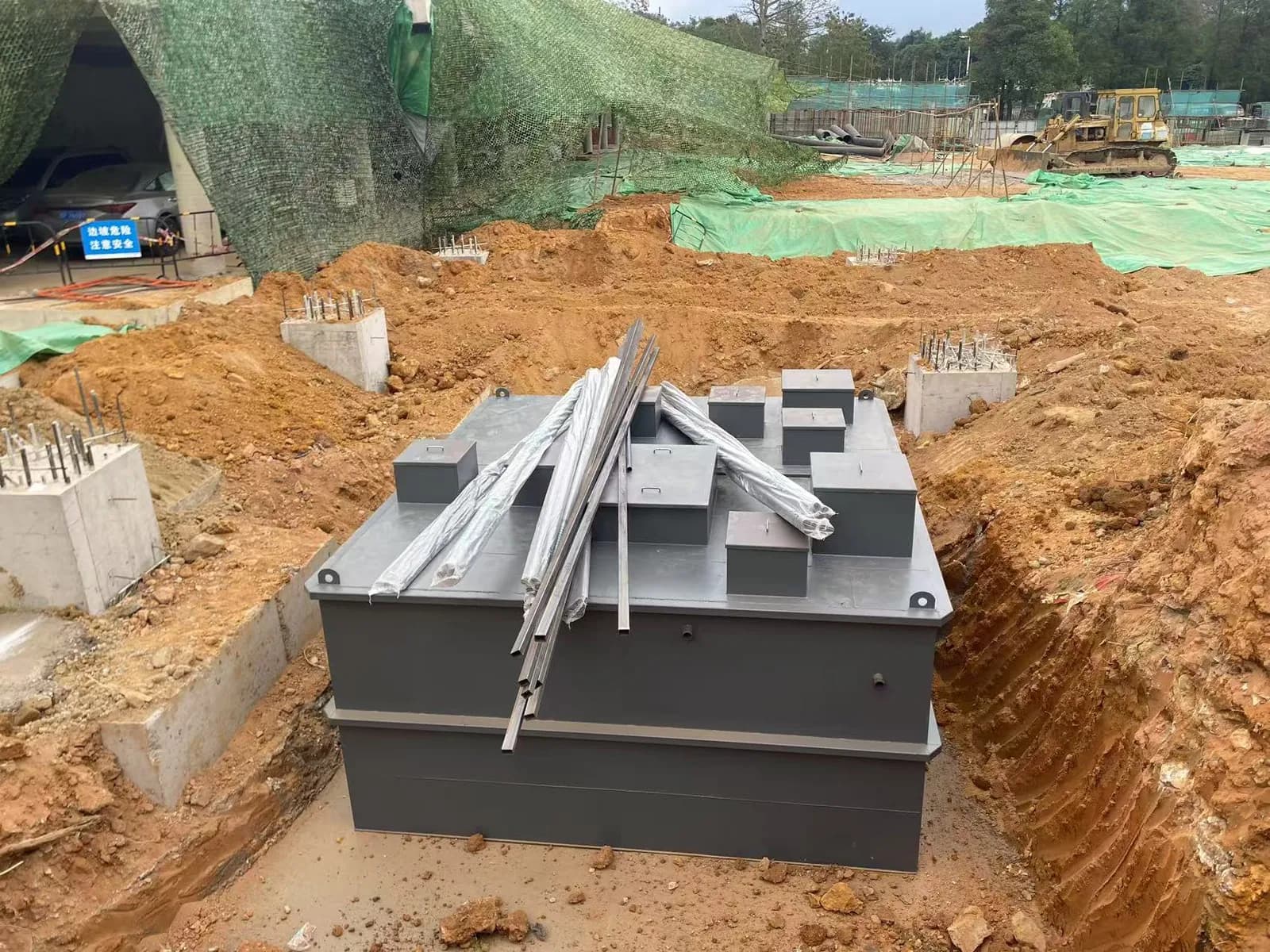 Underground industrial wastewater treatment module positioned during civil installation