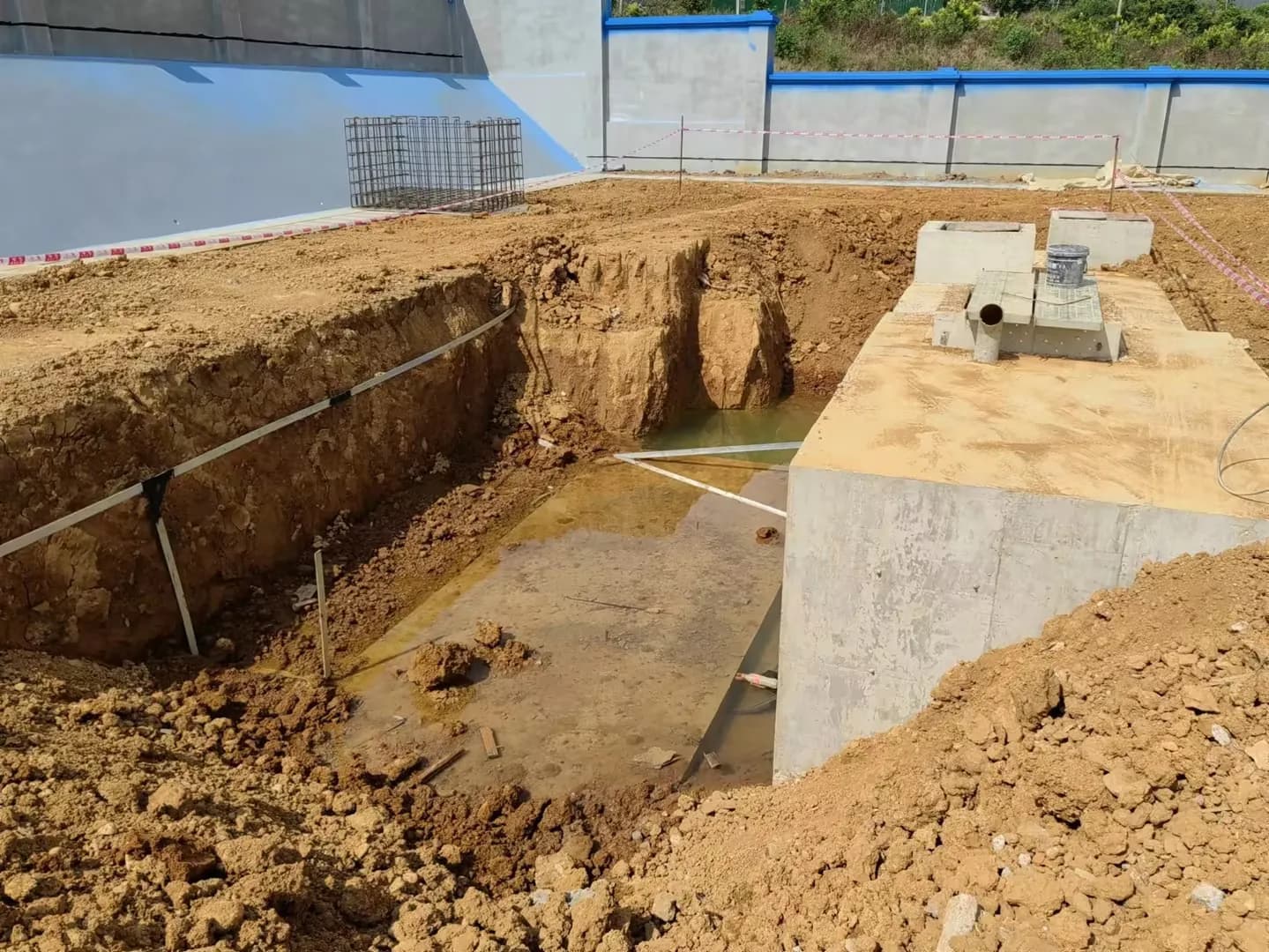 Foundation excavation and concrete structures prepared for wastewater treatment equipment