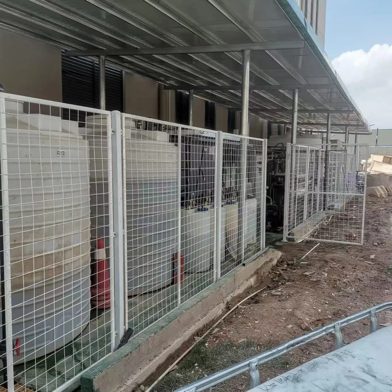 Installed lithium battery wastewater treatment modules with safety fencing and service access